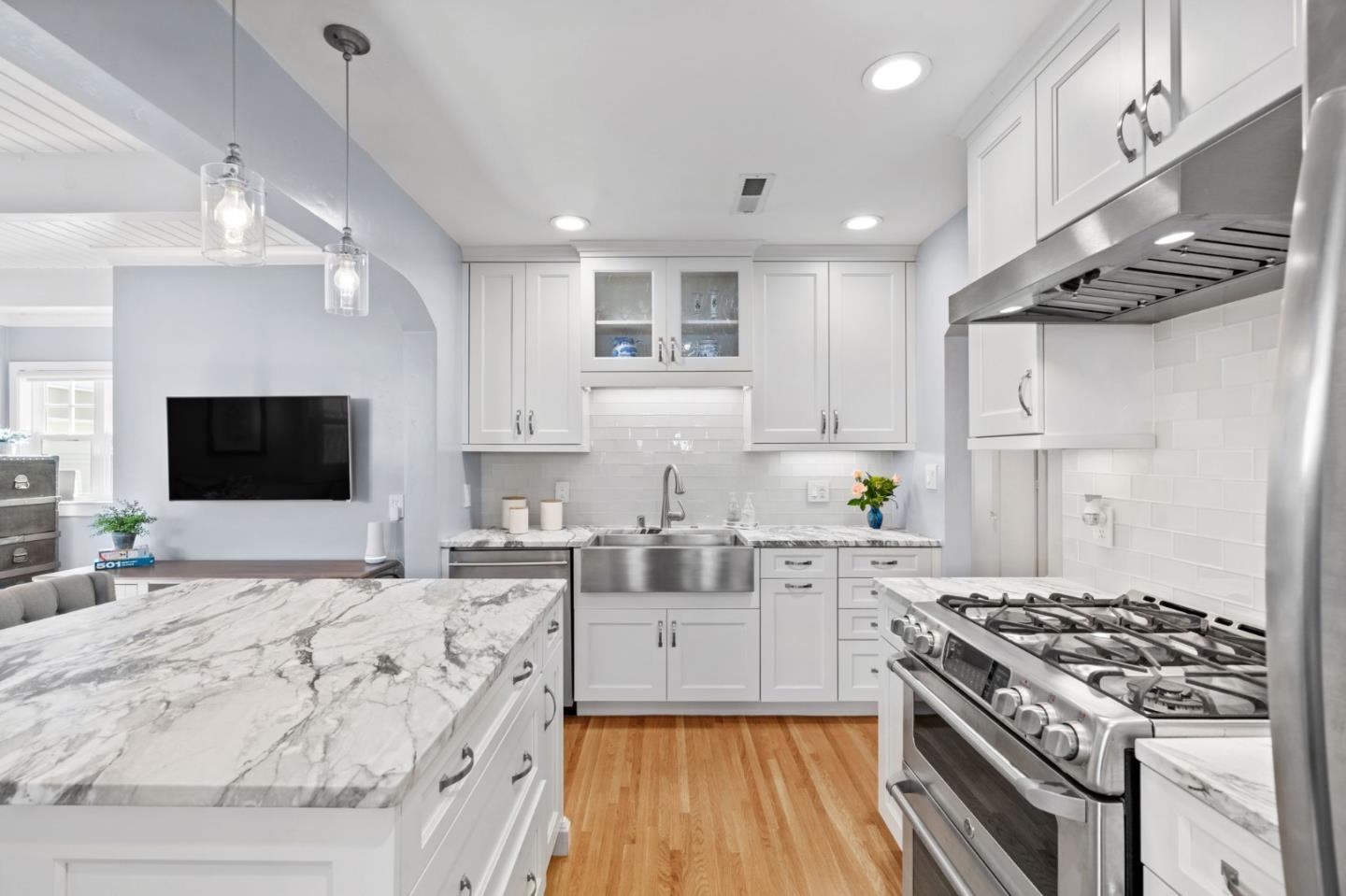 2428 Tulip Road San Jose, CA 95128 - Photo 19 of 59 a kitchen with stainless steel appliances kitchen island granite countertop a stove and a sink