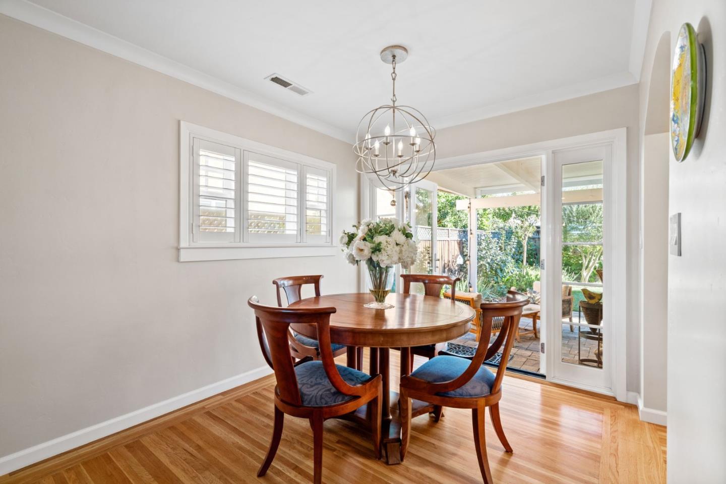 2428 Tulip Road San Jose, CA 95128 - Photo 31 of 59 a view of a dining room with furniture wooden floor and chandelier