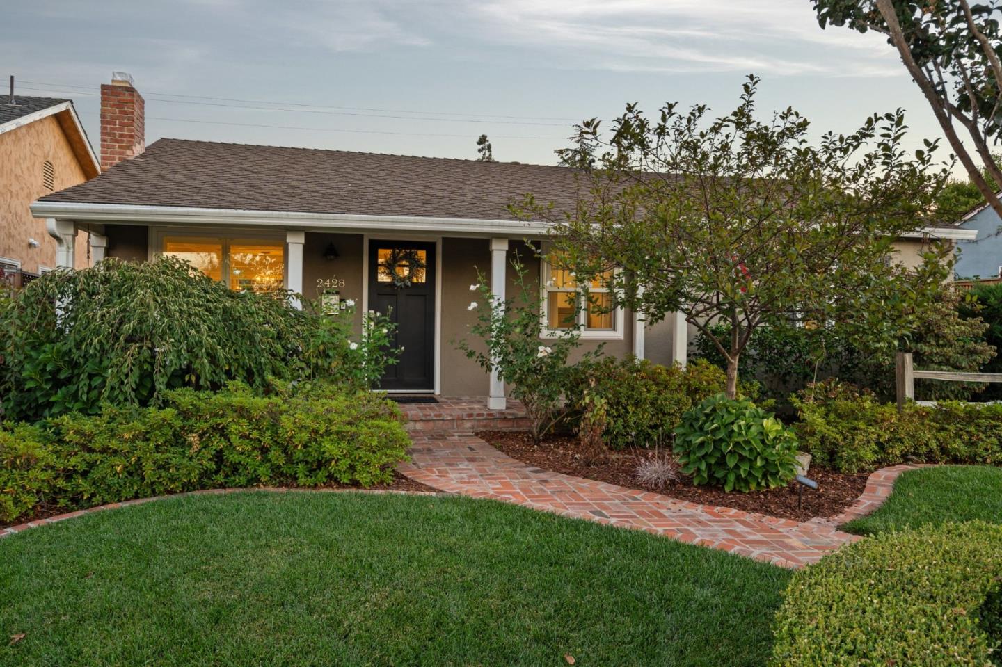 2428 Tulip Road San Jose, CA 95128 - Photo 4 of 59 a front view of a house with garden