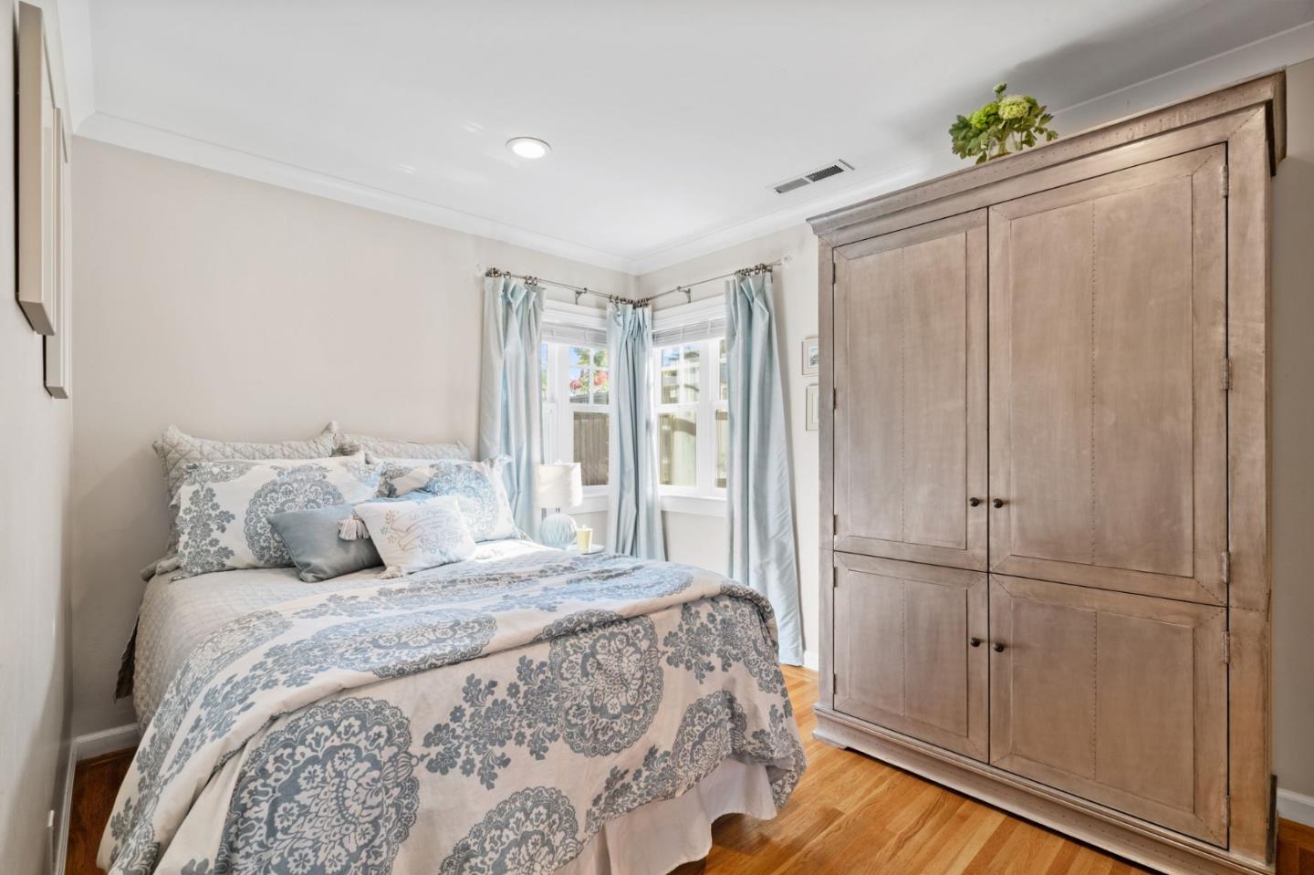 2428 Tulip Road San Jose, CA 95128 - Photo 42 of 59 a large bed sitting in a bedroom next to a window