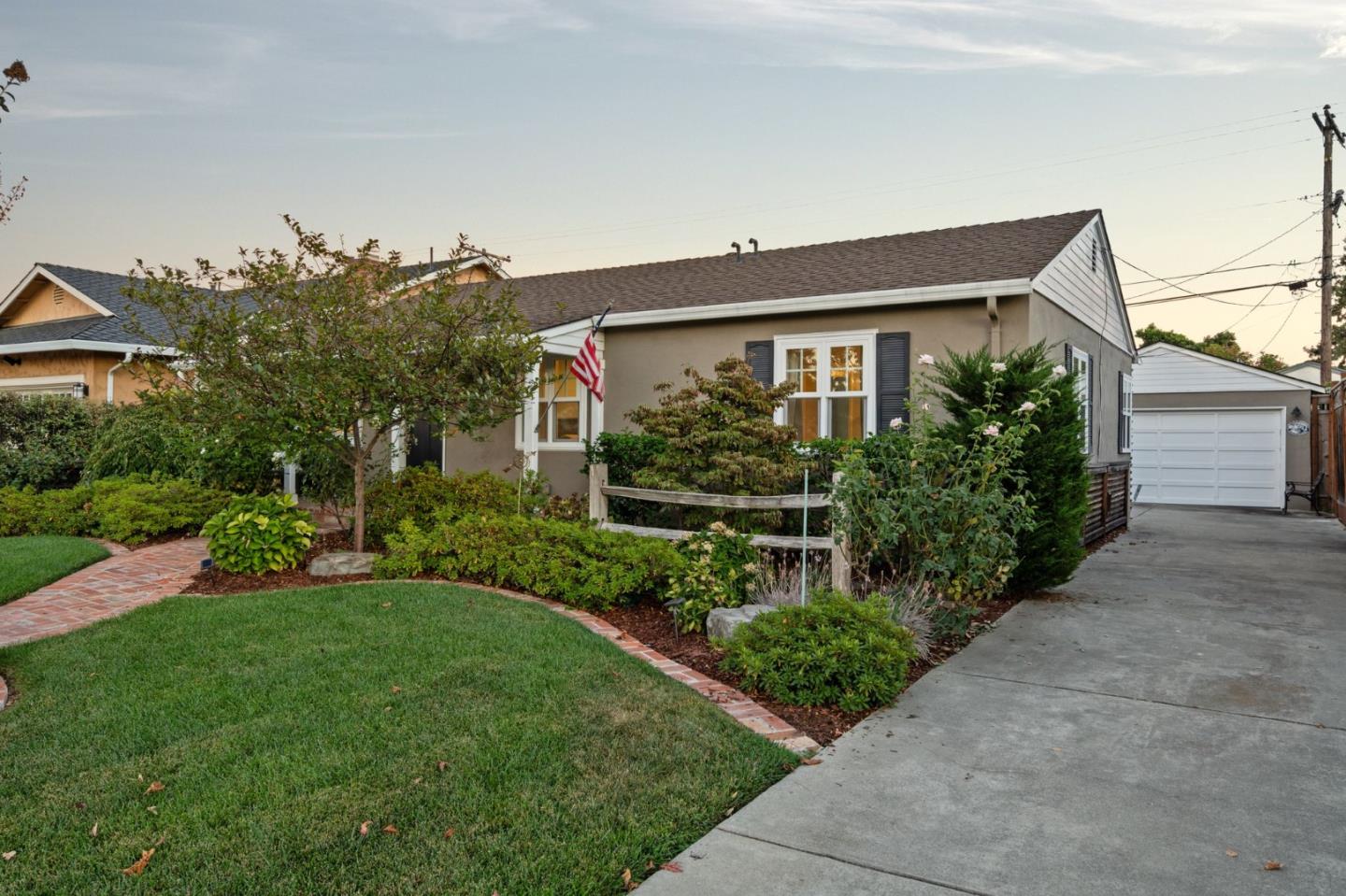 2428 Tulip Road San Jose, CA 95128 - Photo 50 of 59 a front view of a house with a yard and potted plants