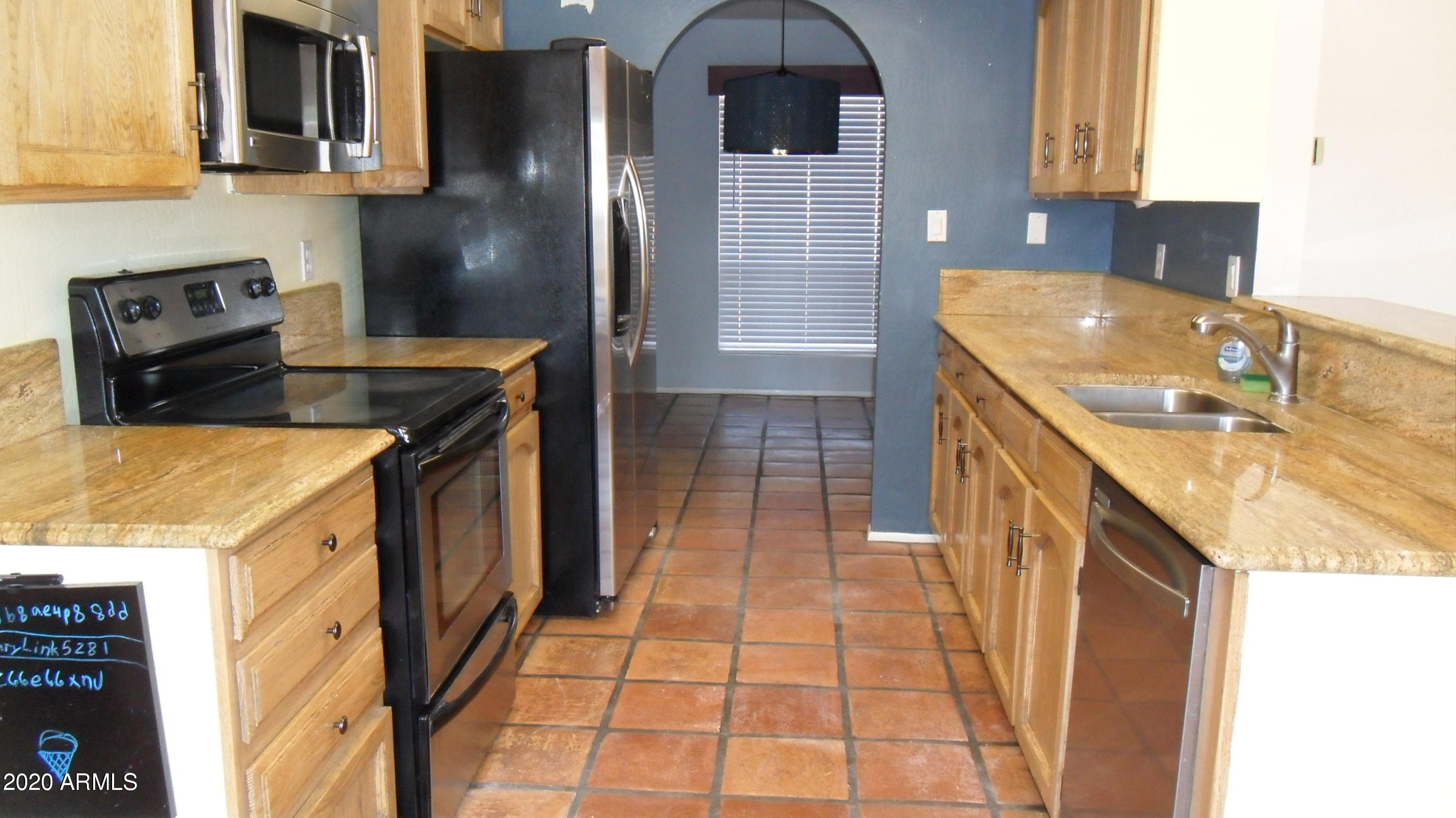 6935 East Hearn Road Scottsdale, AZ 85254 - Photo 4 of 19 KITCHEN W/ GRANITE TOPS