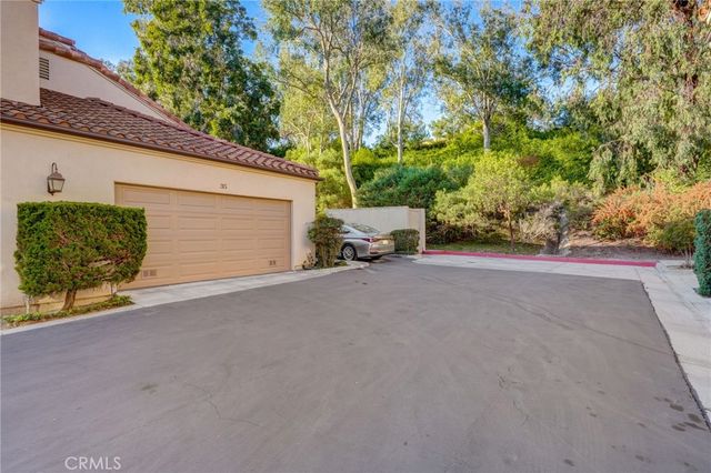 a view of a garage with parked cars