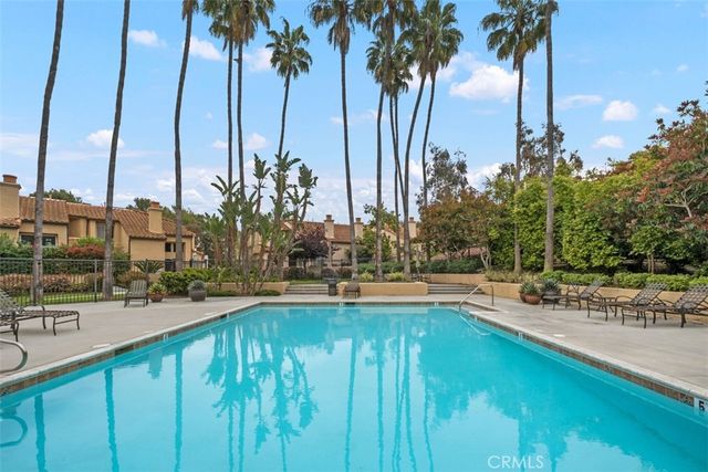 a view of swimming pool with outdoor seating