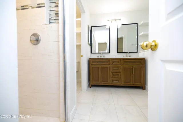 a view of an empty room and a window