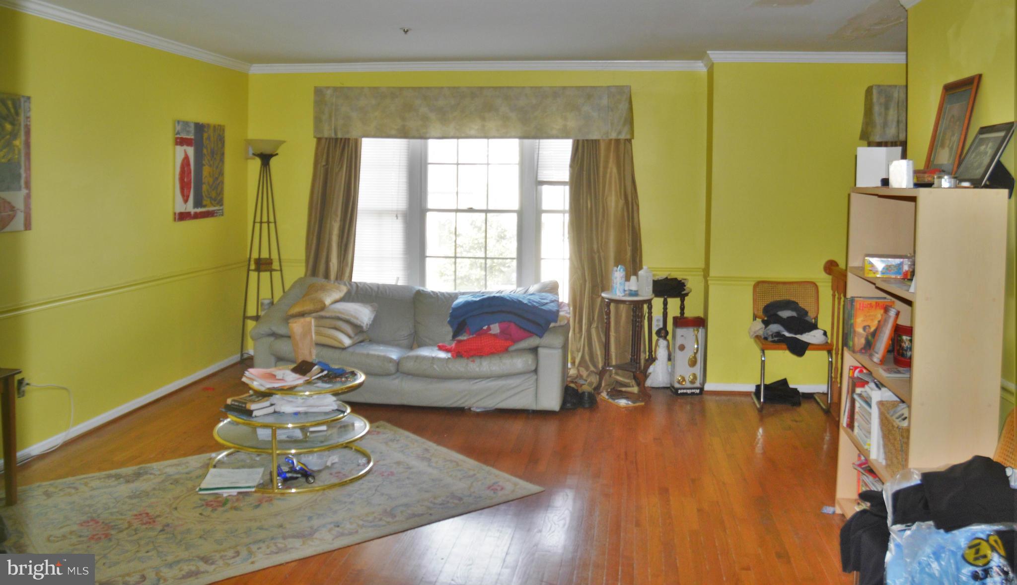 12243 Apache Tears Circle Laurel, MD 20708 - Photo 8 of 22 a living room with furniture and a wooden floor