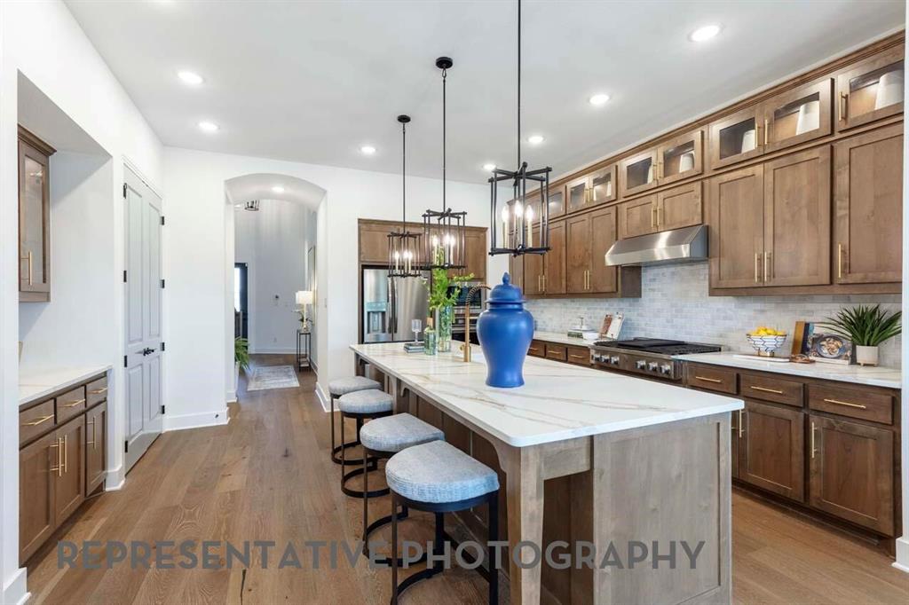 1621 Primms Place Fort Worth, TX 76052 - Photo 4 of 40 a kitchen with stainless steel appliances granite countertop a sink a stove and a refrigerator