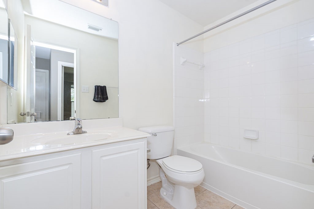 242 Drake Run Lane Dickinson, TX 77539 - Photo 16 of 18 a bathroom with a sink toilet and shower