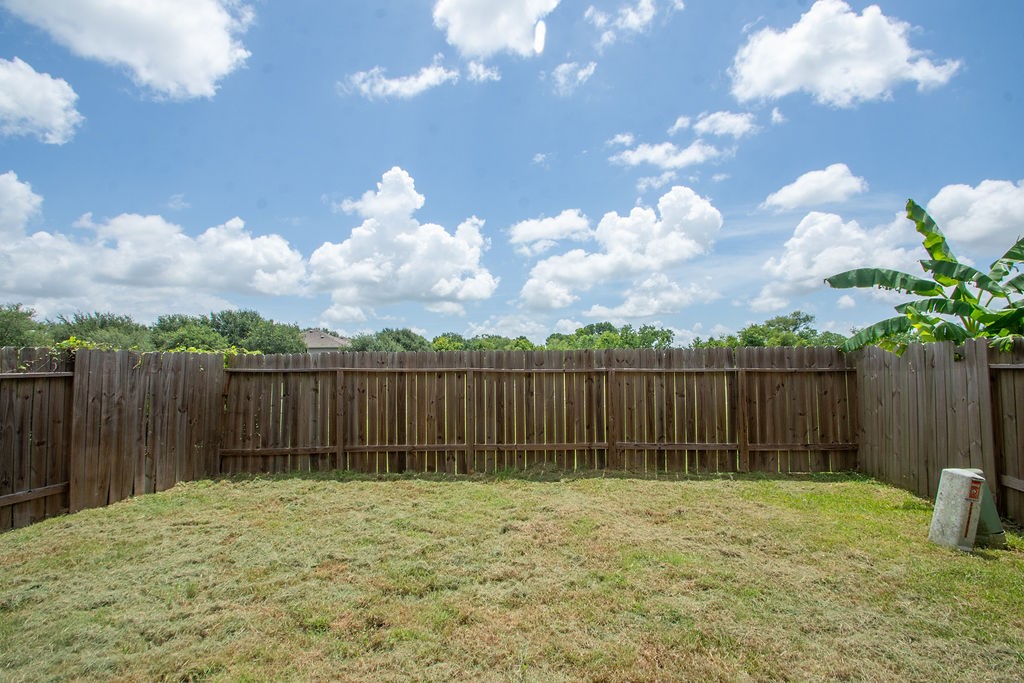 242 Drake Run Lane Dickinson, TX 77539 - Photo 18 of 18 a view of backyard with wooden fence