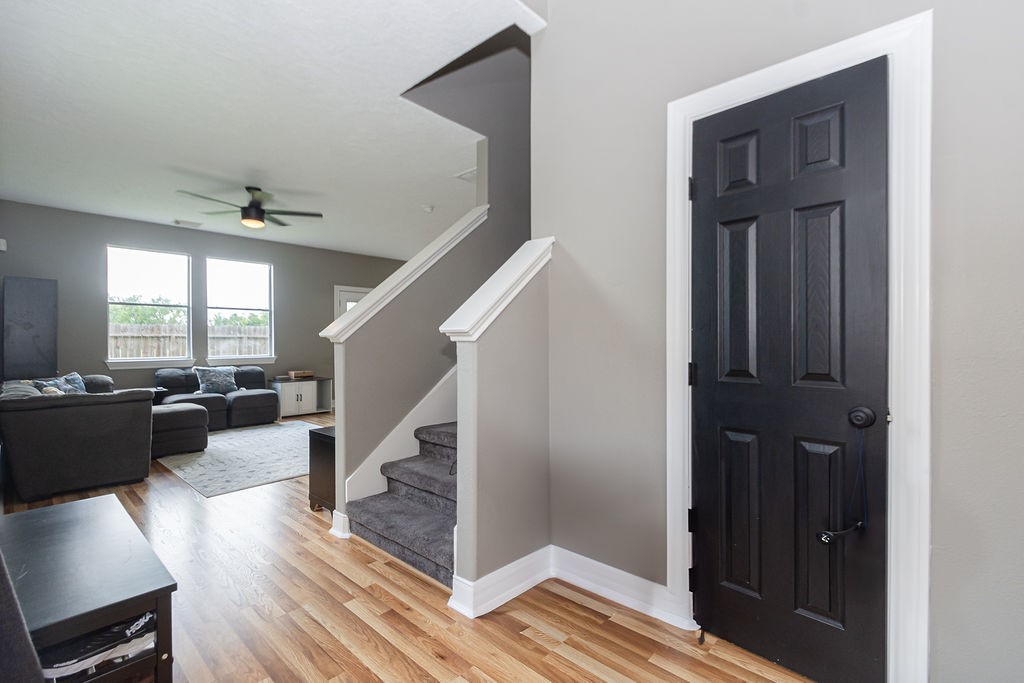 242 Drake Run Lane Dickinson, TX 77539 - Photo 2 of 18 a view of entryway and kitchen with wooden floor