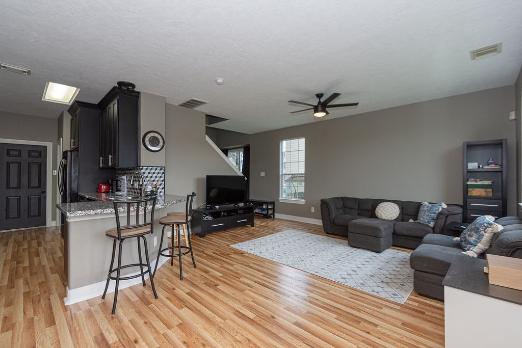 242 Drake Run Lane Dickinson, TX 77539 - Photo 5 of 18 a living room with furniture and wooden floor