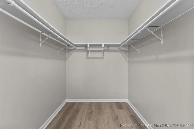 a view of an empty walk in closet