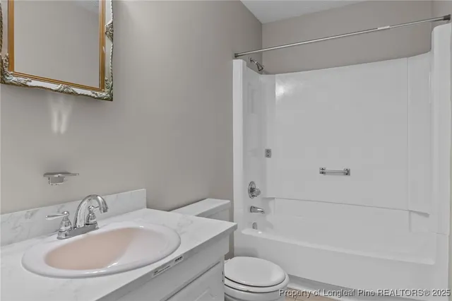 a bathroom with a toilet a sink and a bathtub