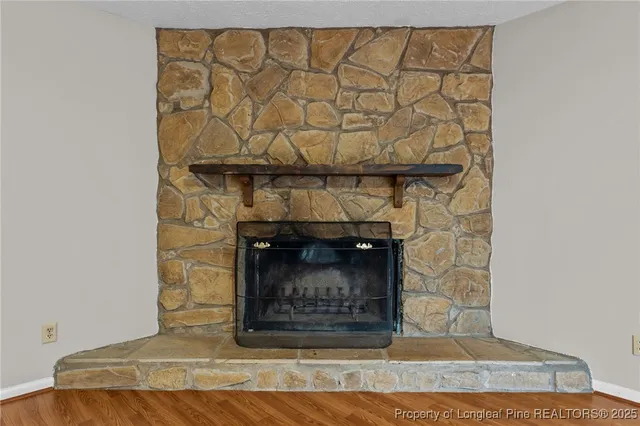 a room with a fireplace and a fireplace