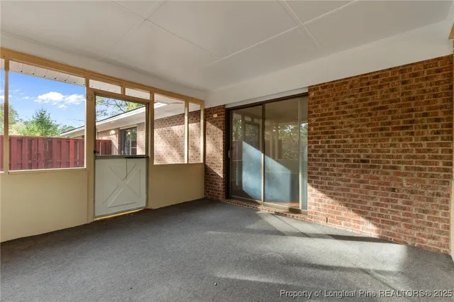 a view of an empty room with a fireplace