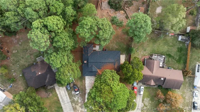 an aerial view of a house with yard outdoor and lake view