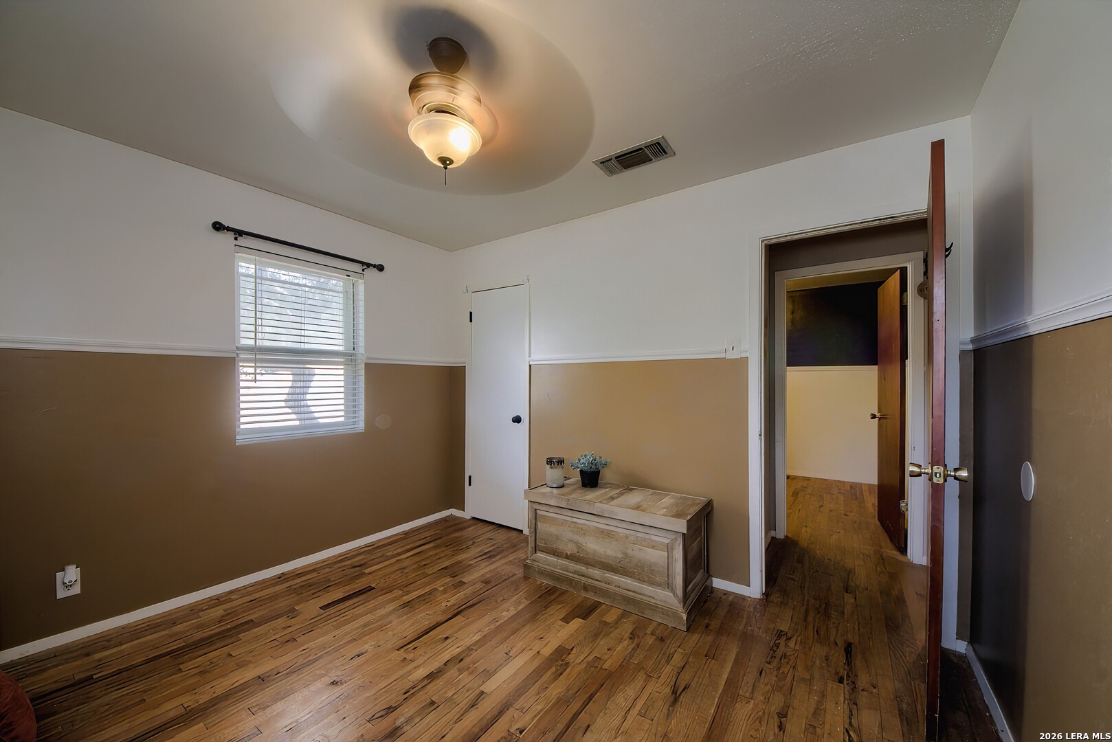 3909 McCall Creek Road Blanco, TX 78606 - Photo 18 of 55 a room with wooden floor and furniture