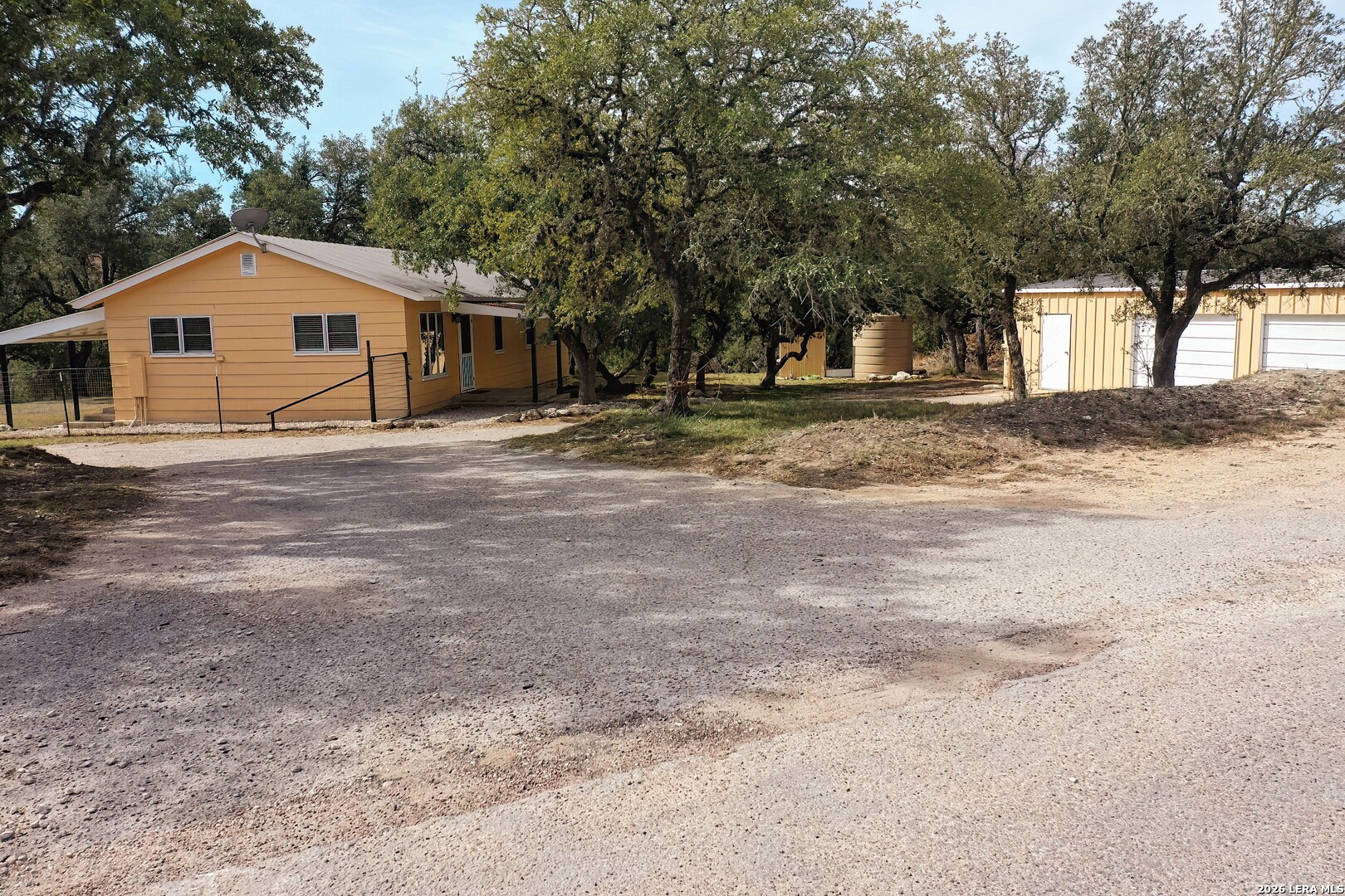 3909 McCall Creek Road Blanco, TX 78606 - Photo 2 of 55 a front view of a house with a yard