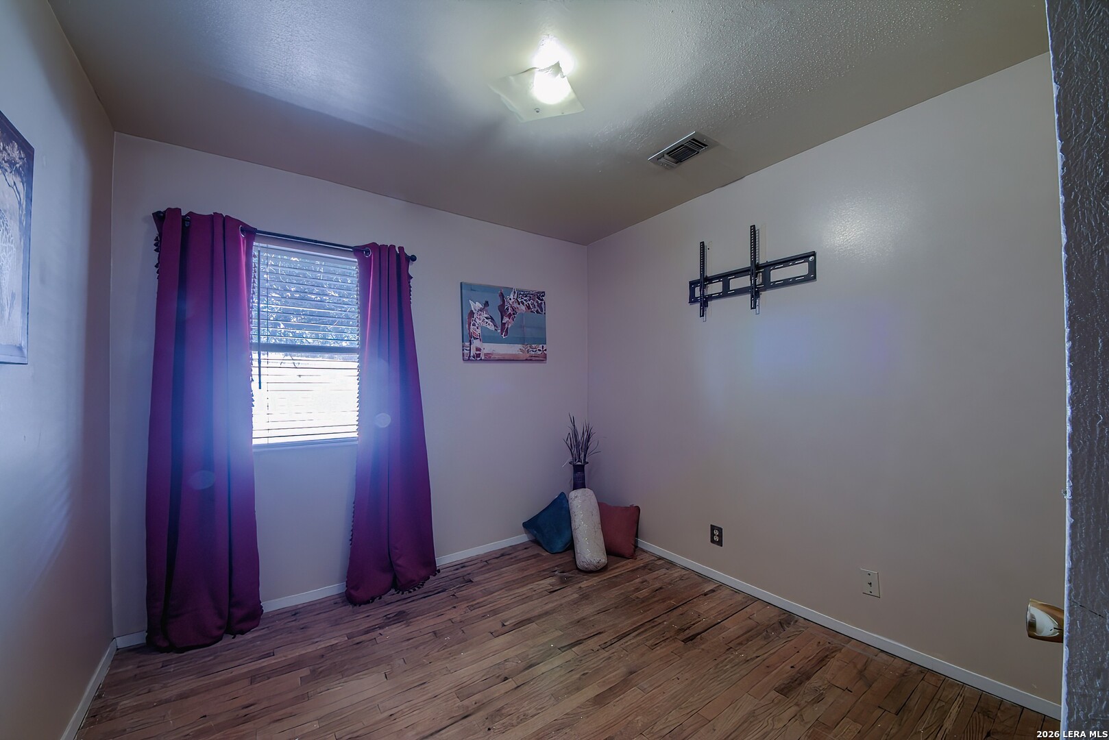3909 McCall Creek Road Blanco, TX 78606 - Photo 23 of 55 a view of a room with wooden floor and windows