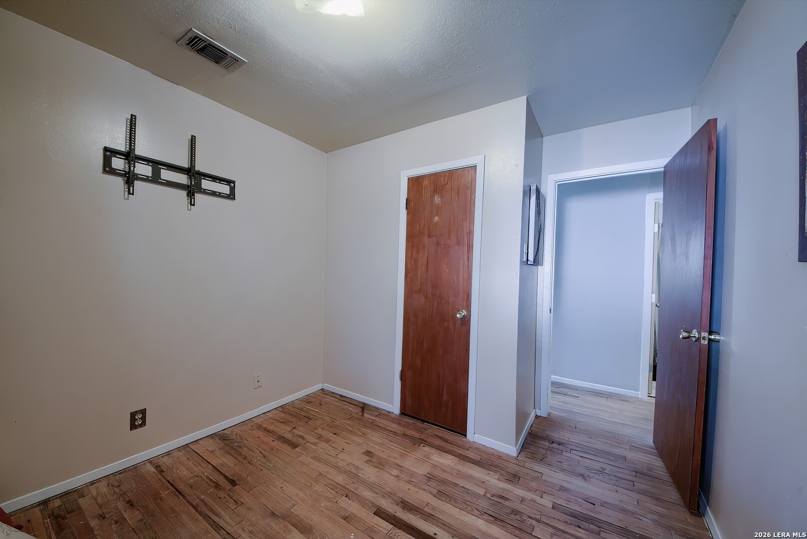 3909 McCall Creek Road Blanco, TX 78606 - Photo 24 of 55 a view of empty room with wooden floor