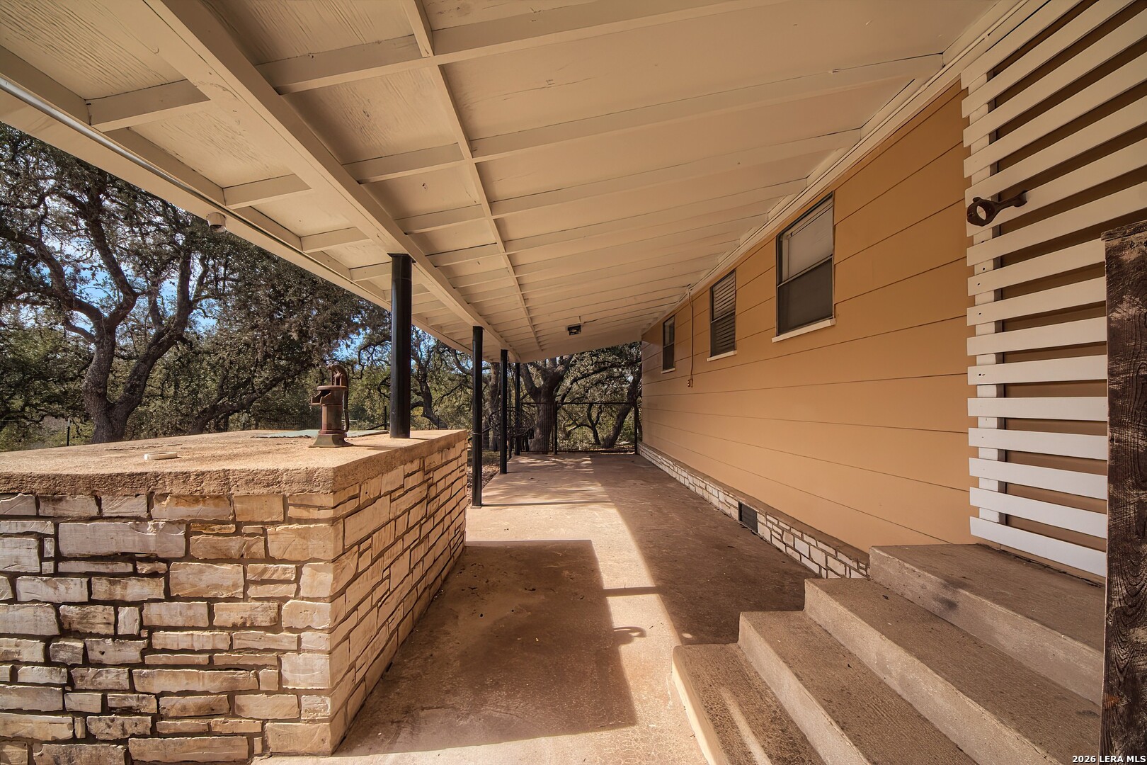 3909 McCall Creek Road Blanco, TX 78606 - Photo 27 of 55 a view of a patio with a table and chairs