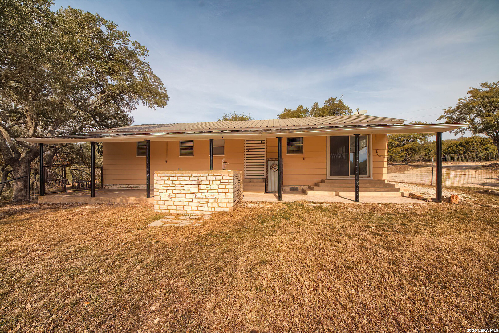3909 McCall Creek Road Blanco, TX 78606 - Photo 29 of 55 a front view of a house with a yard and garage