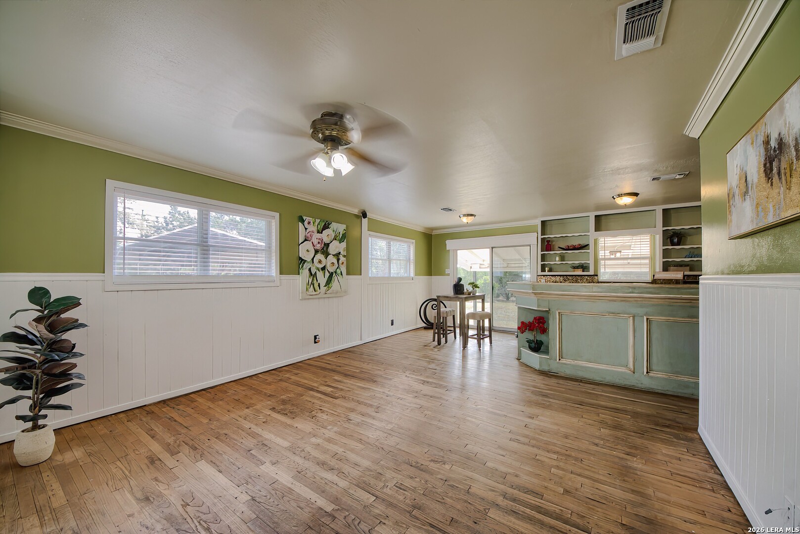3909 McCall Creek Road Blanco, TX 78606 - Photo 4 of 55 a view of a kitchen and dining room with wooden floor