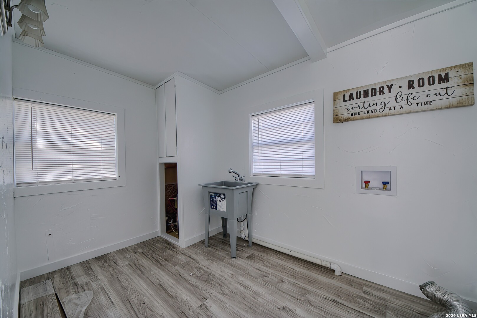 3909 McCall Creek Road Blanco, TX 78606 - Photo 41 of 55 a view of an empty room with wooden floor and a window