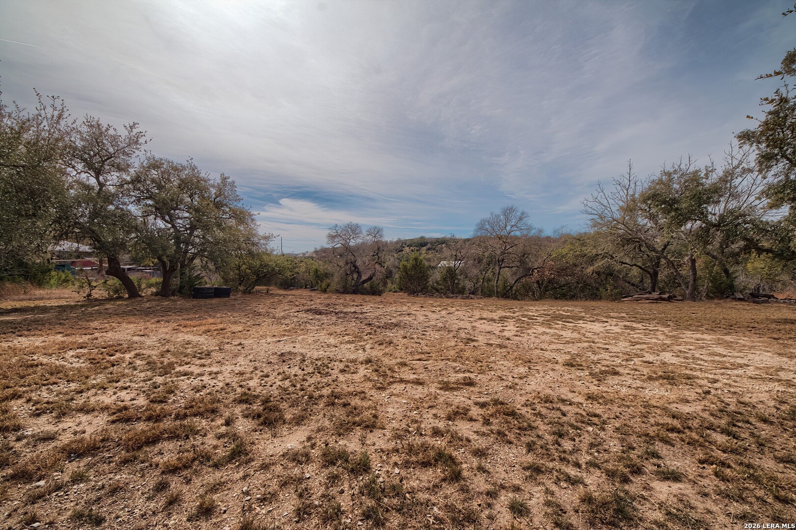 3909 McCall Creek Road Blanco, TX 78606 - Photo 43 of 55 a view of a field with trees in background