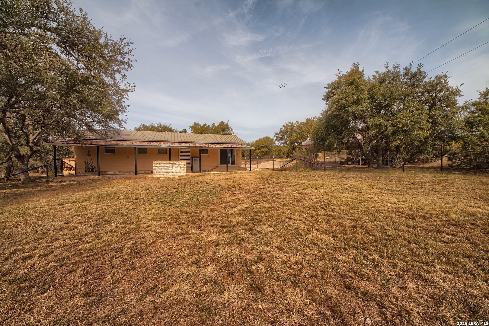 3909 McCall Creek Road Blanco, TX 78606 - Photo 46 of 55 a front view of a house with a yard