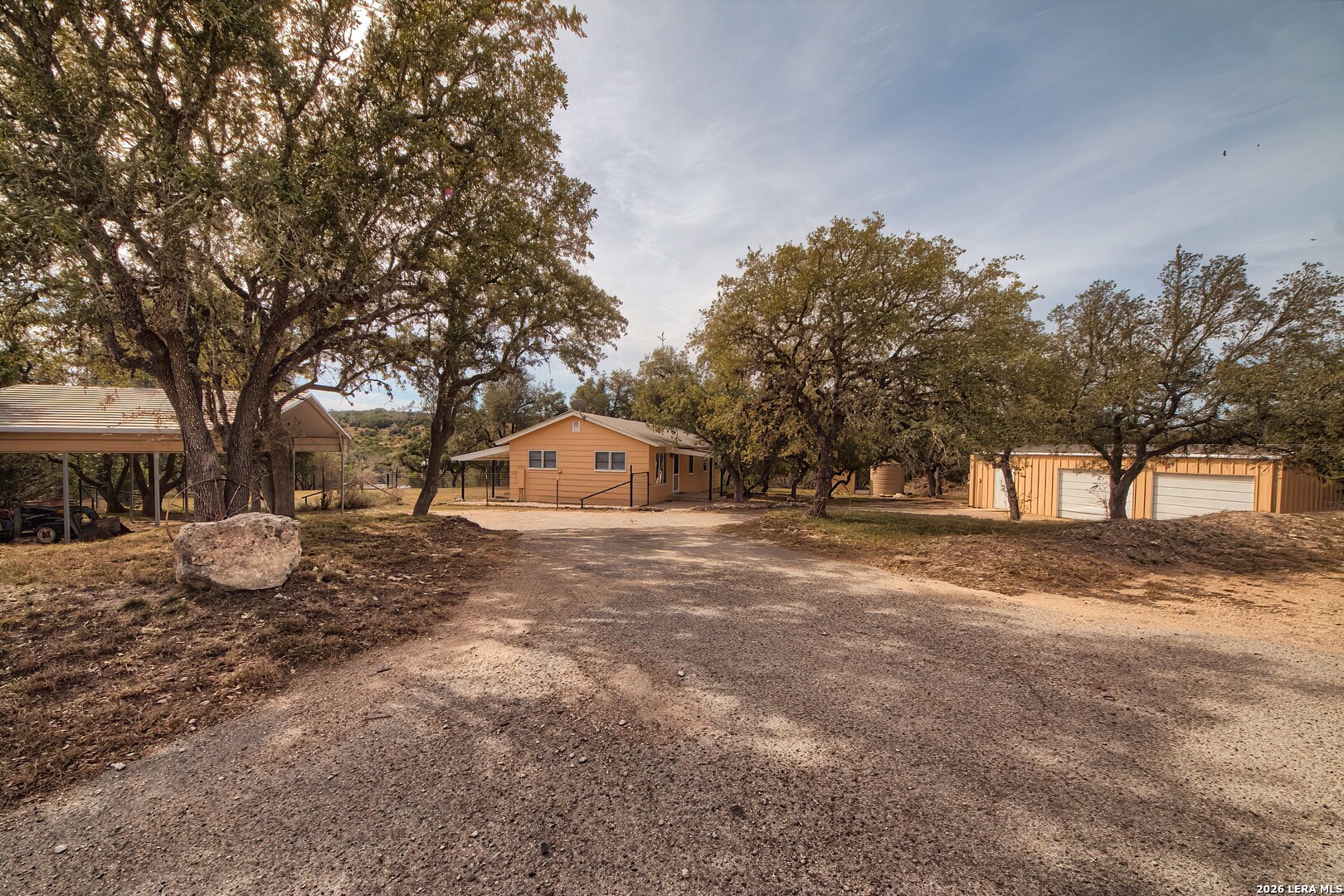 3909 McCall Creek Road Blanco, TX 78606 - Photo 49 of 55 a view of a house with a outdoor space