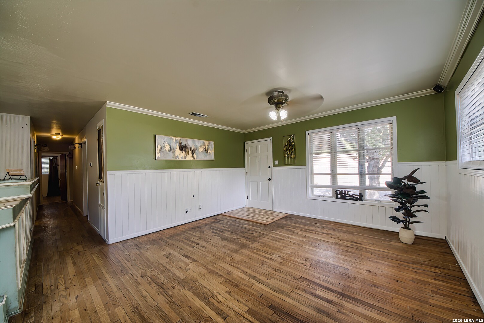 3909 McCall Creek Road Blanco, TX 78606 - Photo 6 of 55 a view of a room with window and wooden floor