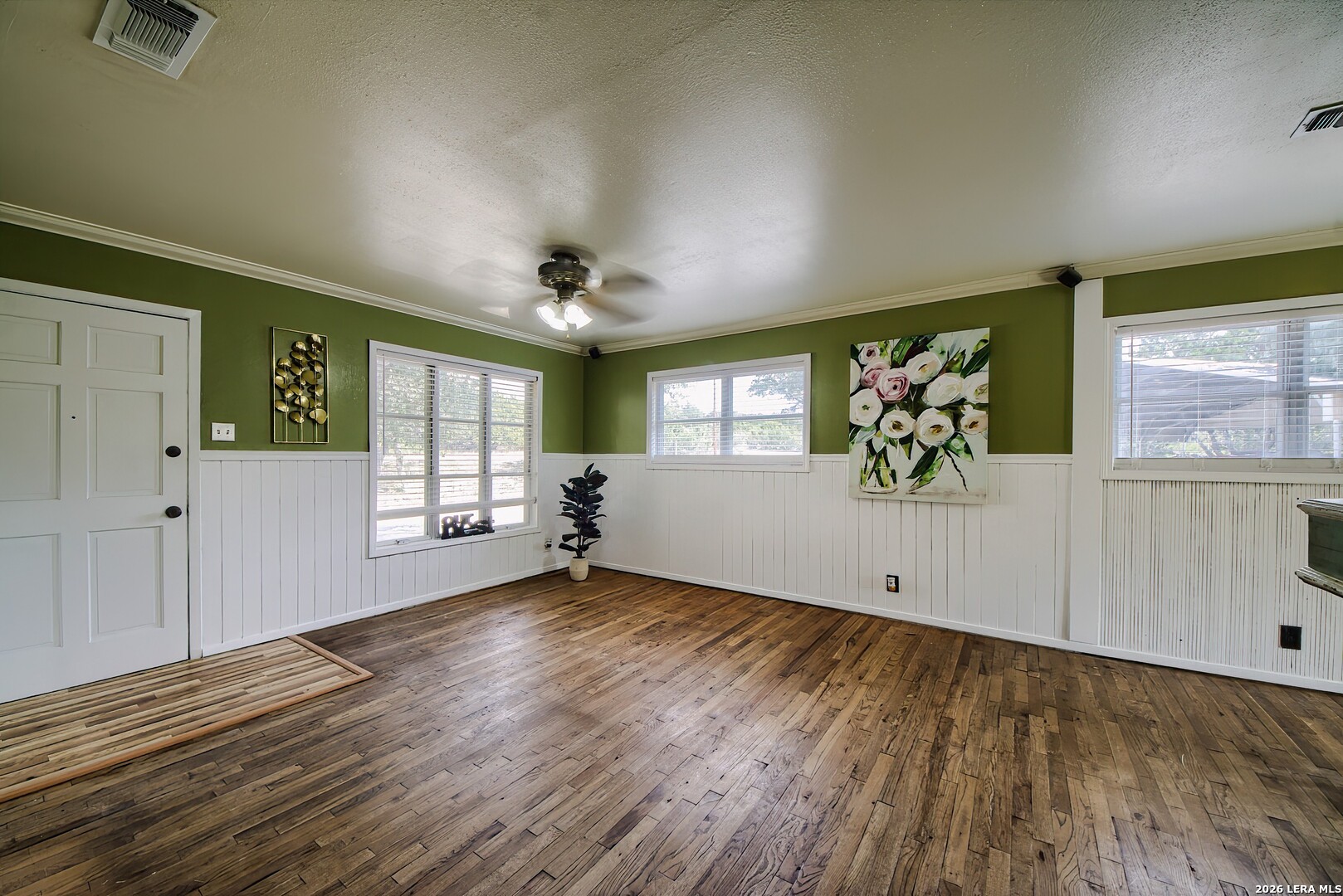 3909 McCall Creek Road Blanco, TX 78606 - Photo 7 of 55 a view of an empty room with a window and wooden floor