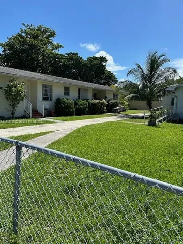a house view with a garden space