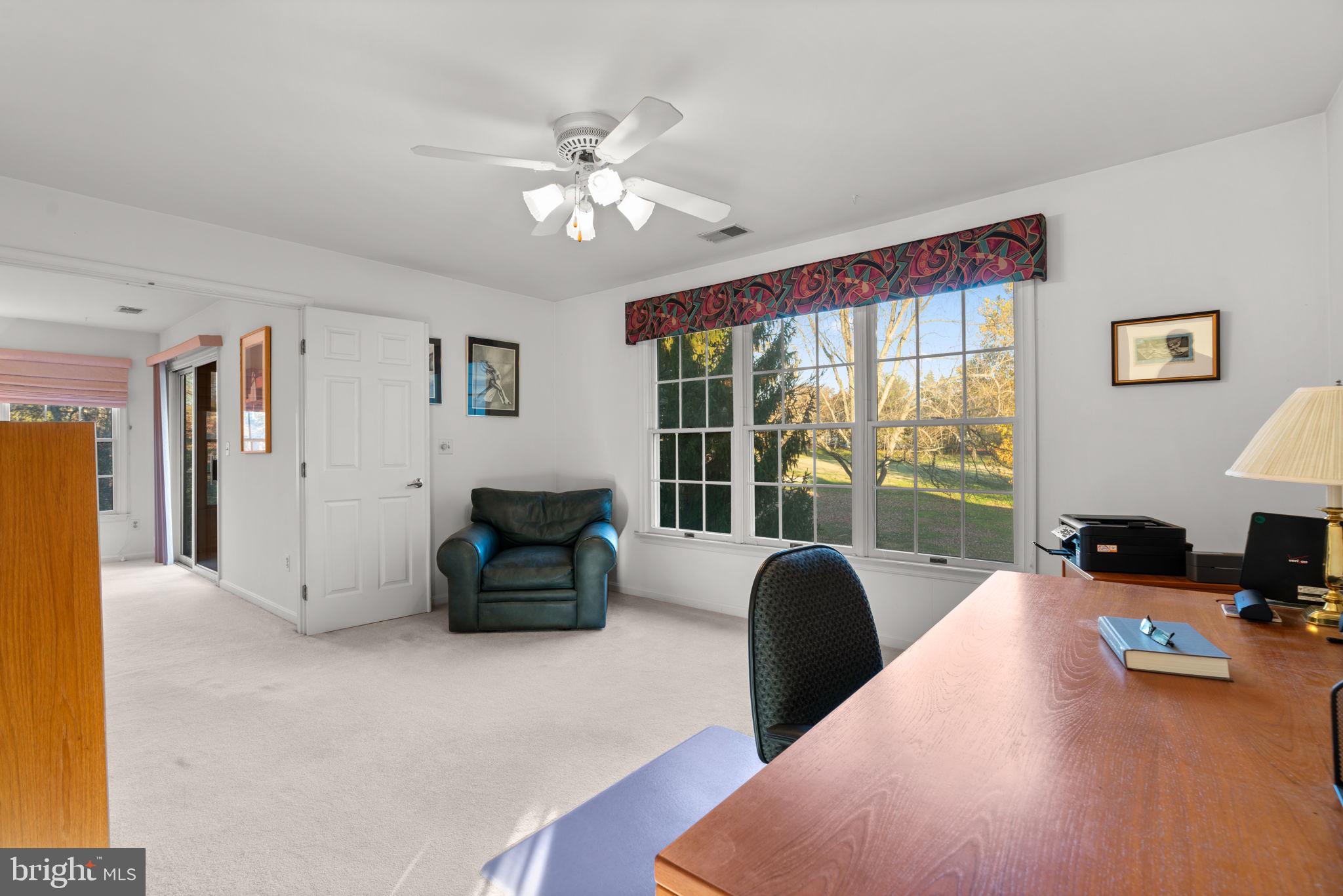 5161 Harpers Farm Road, Unit 27 Columbia, MD 21044 - Photo 25 of 55 a living room with furniture and a flat screen tv