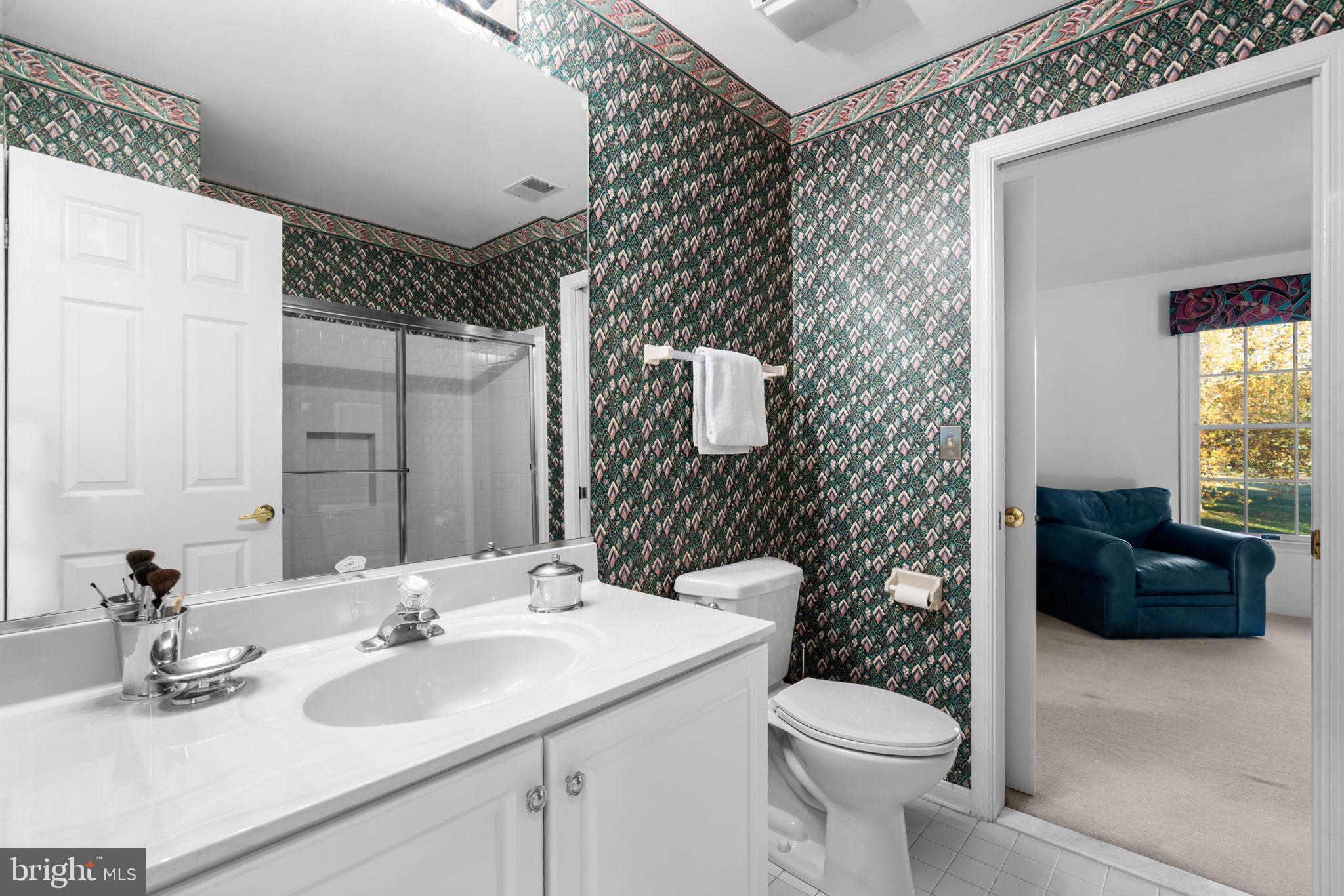 5161 Harpers Farm Road, Unit 27 Columbia, MD 21044 - Photo 26 of 55 a bathroom with a sink mirror and toilet