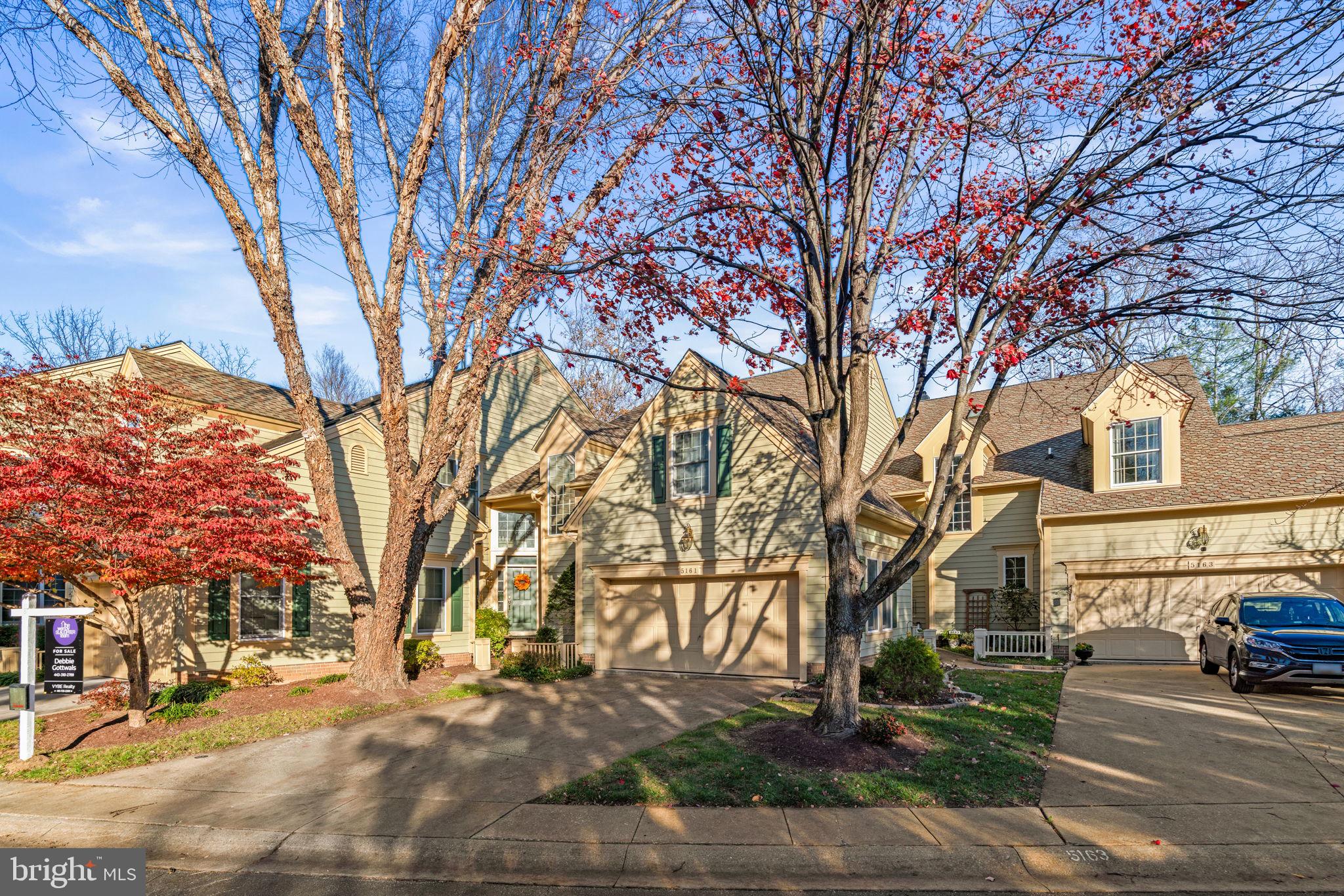 5161 Harpers Farm Road, Unit 27 Columbia, MD 21044 - Photo 3 of 55 a street view with large trees