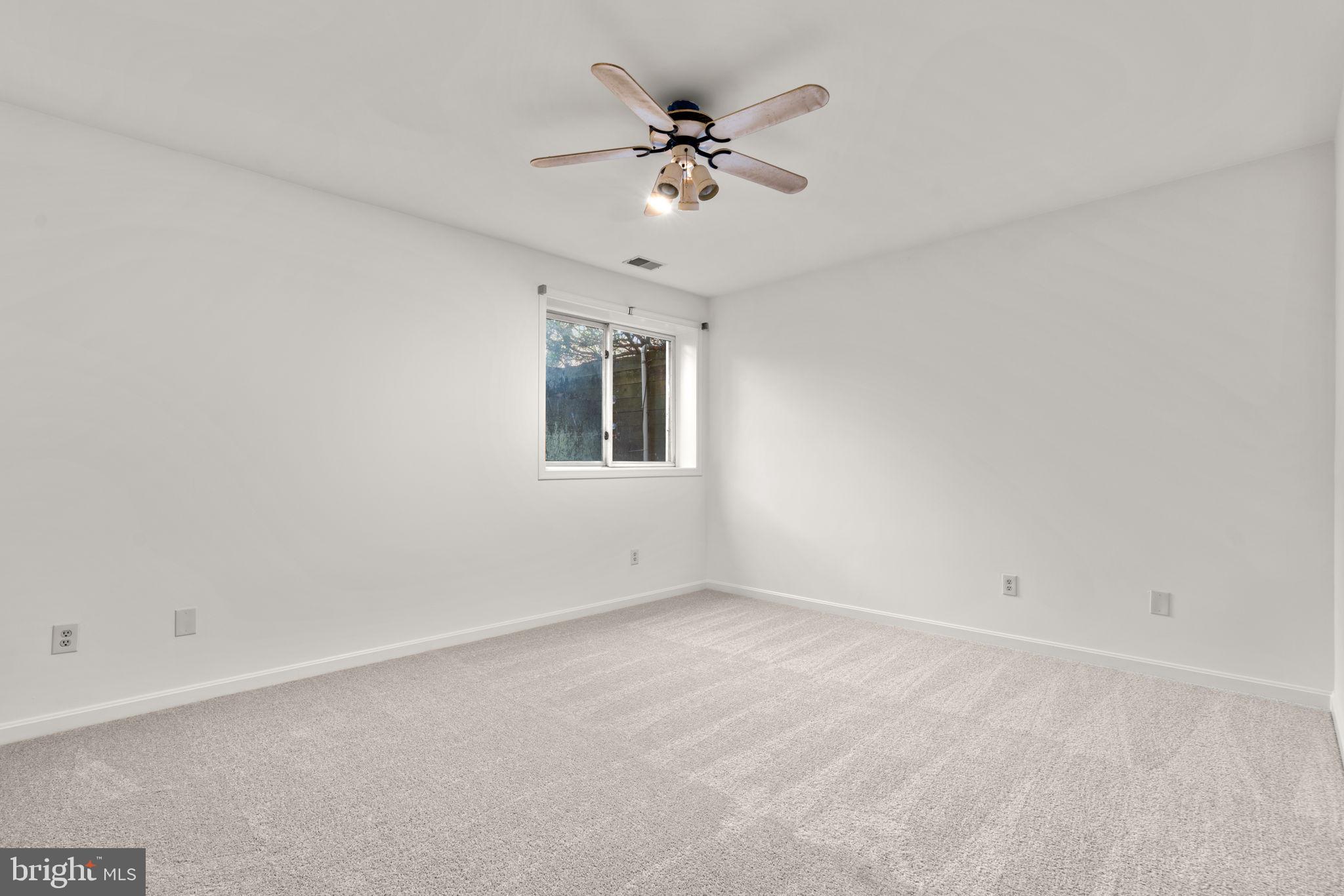 5161 Harpers Farm Road, Unit 27 Columbia, MD 21044 - Photo 37 of 55 a view of an empty room with a ceiling fan