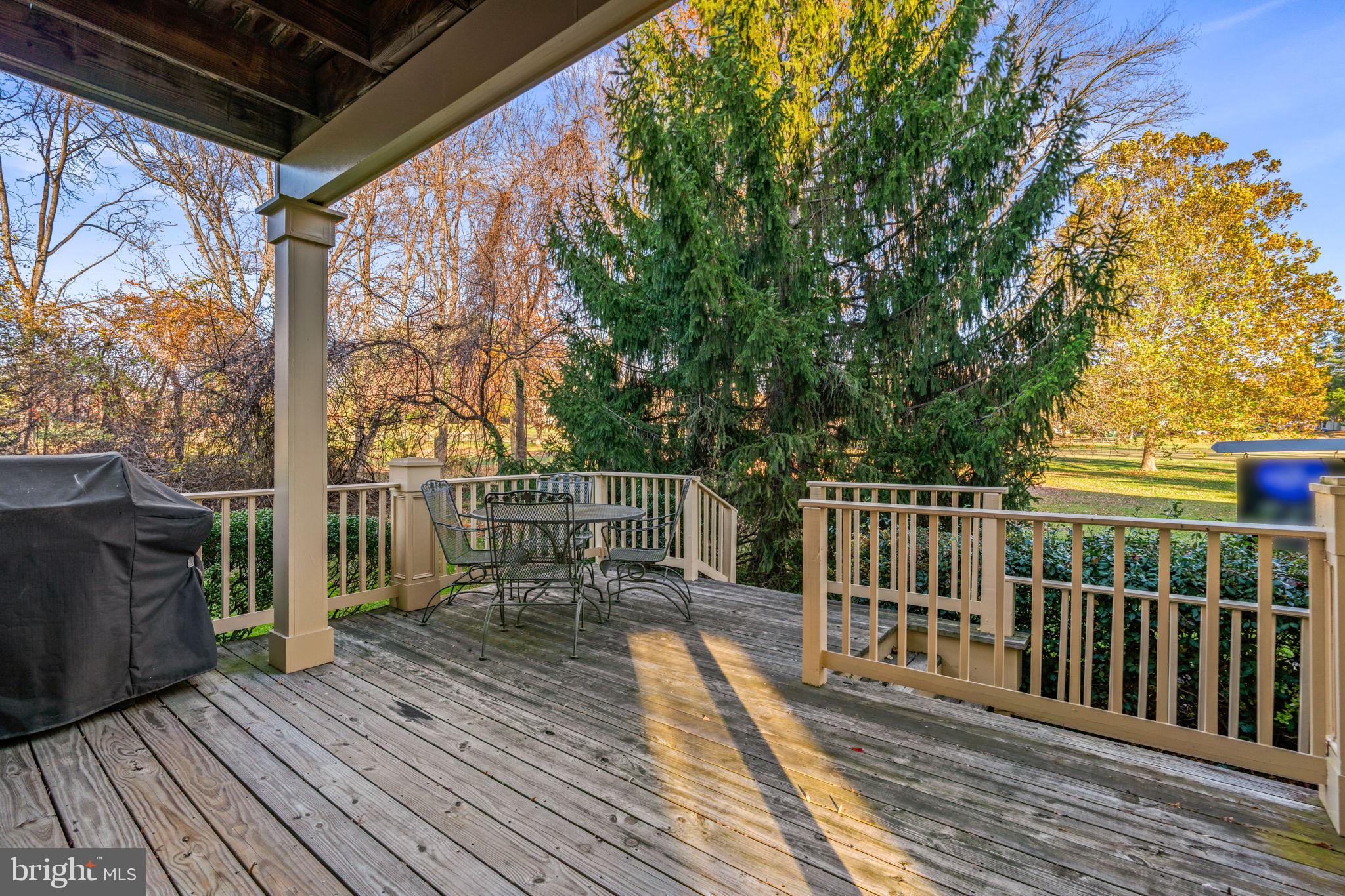 5161 Harpers Farm Road, Unit 27 Columbia, MD 21044 - Photo 40 of 55 a view of balcony with wooden floor and fence