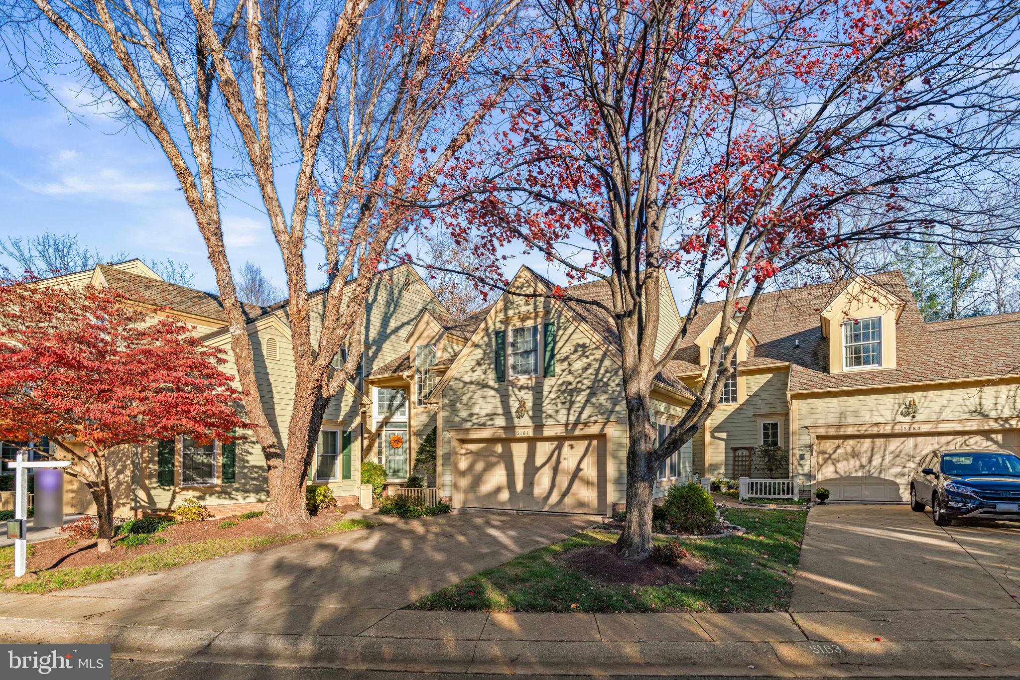5161 Harpers Farm Road, Unit 27 Columbia, MD 21044 - Photo 4 of 55 a street view with large trees