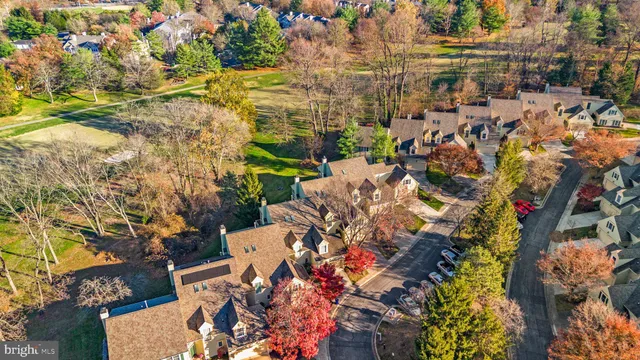 an aerial view of house with yard swimming pool and outdoor seating