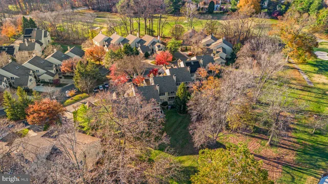 an aerial view of a house with a yard and garden