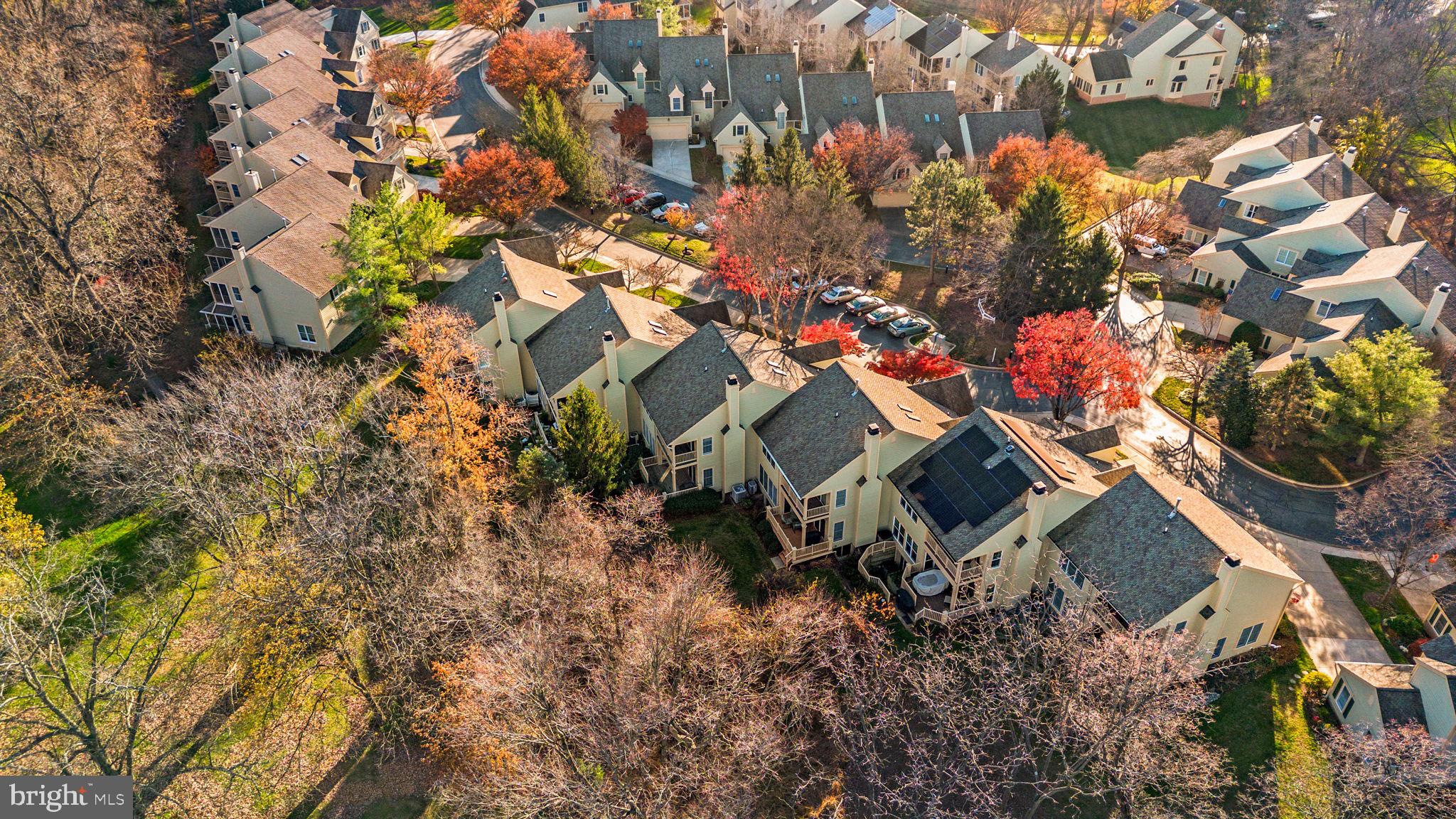 5161 Harpers Farm Road, Unit 27 Columbia, MD 21044 - Photo 50 of 55 an aerial view of a house with a yard and garden