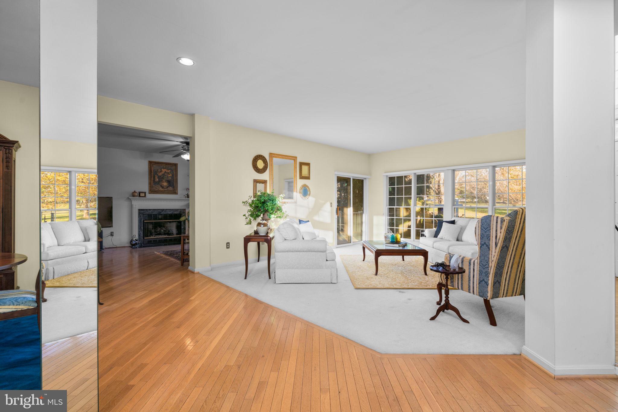 5161 Harpers Farm Road, Unit 27 Columbia, MD 21044 - Photo 5 of 55 a living room with furniture and a table