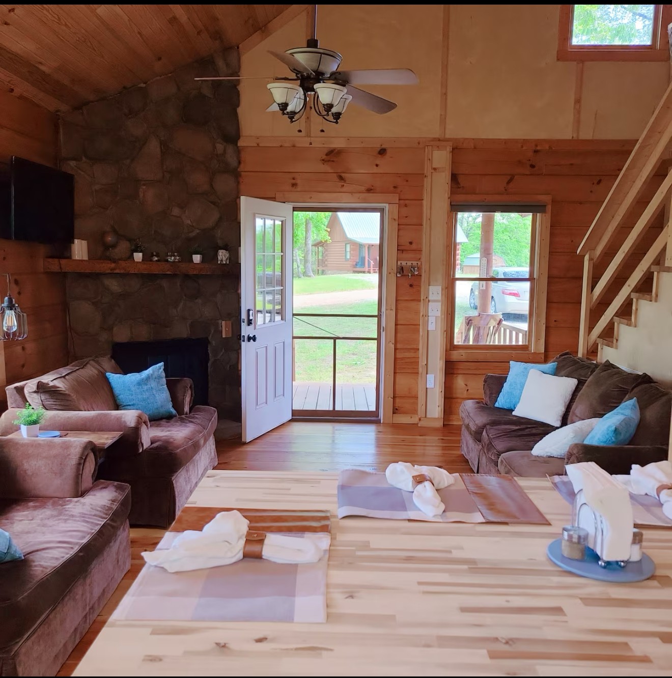 80 Tater Bug Lane Clifton, TN 38425 - Photo 25 of 25 a living room with furniture a fireplace and a flat screen tv