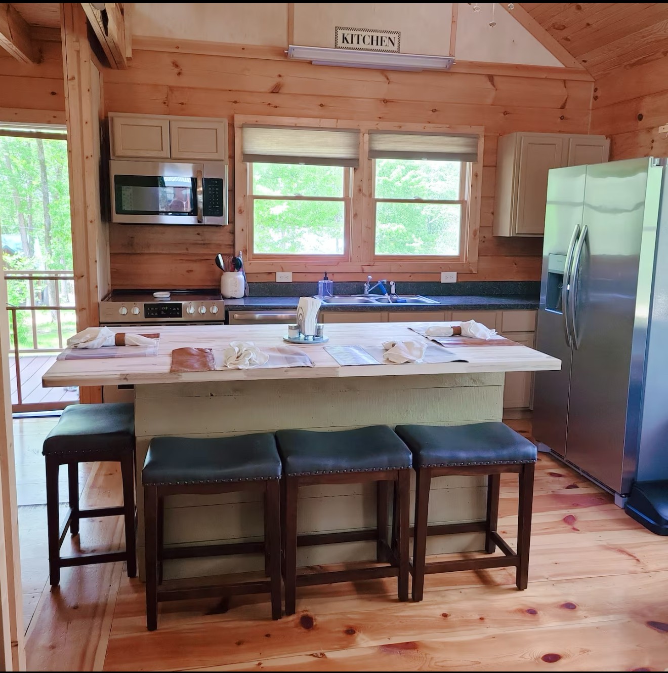 80 Tater Bug Lane Clifton, TN 38425 - Photo 3 of 25 a kitchen with a stove a sink refrigerator and a microwave