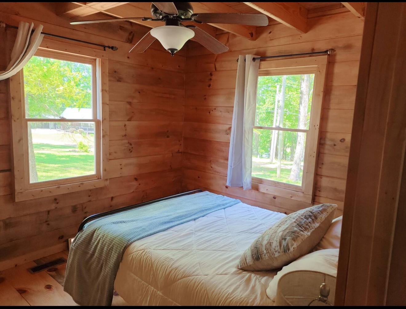 80 Tater Bug Lane Clifton, TN 38425 - Photo 9 of 25 a bedroom with a bed and a window