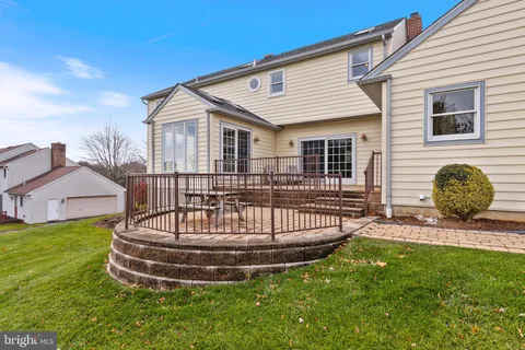 a kitchen with stainless steel appliances kitchen island granite countertop a stove a sink and a refrigerator