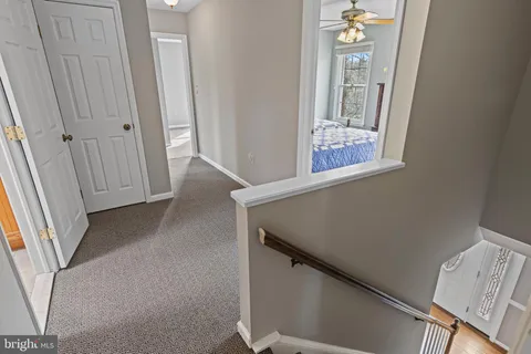 an empty room with windows and entrance