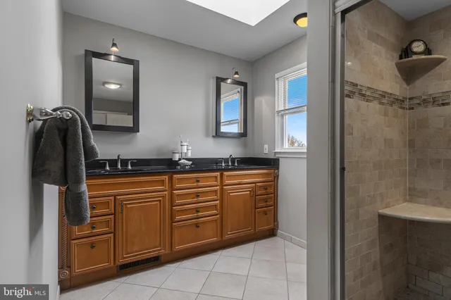 a front view of a house with garden and porch